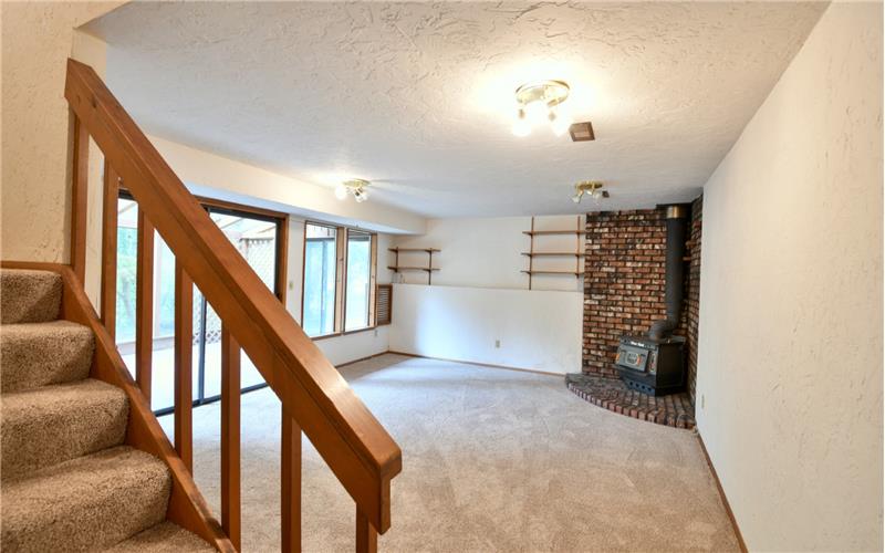 Heading downstairs to the lower level, you are greeted with a 2nd living area. New carpet and a new hot water heater.
