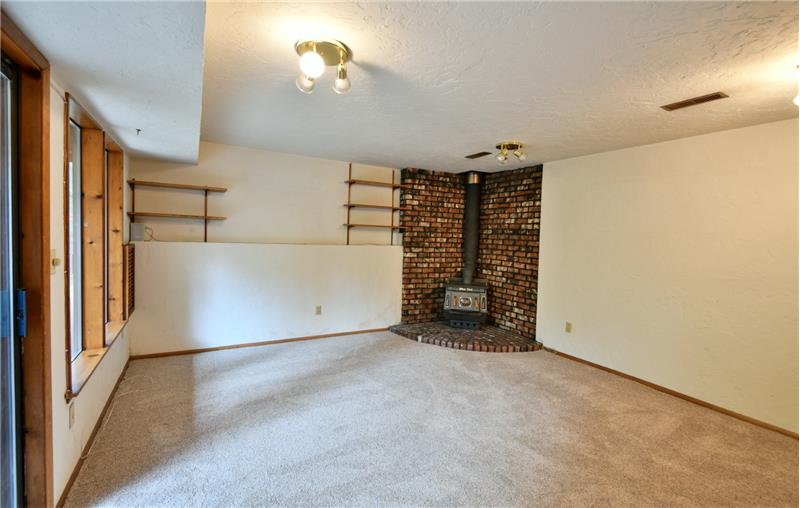 Like to hear the crackle of a fire?  The home's second fireplace, which is wood-burning, is down here to keep you cozy!