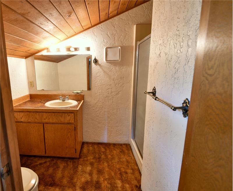 Even the bathroom has a woodsy feeling with the wood planked ceilings.  3/4 bath -shower.