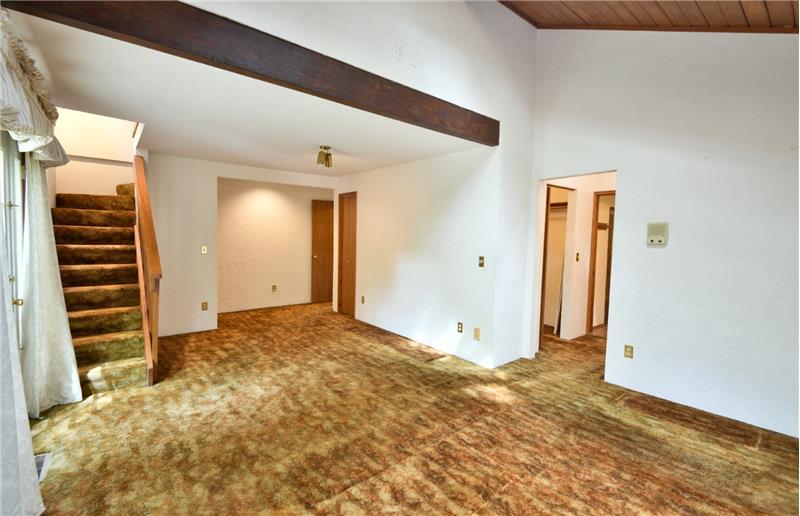 Wonderful architecture makes this room feel very spacious. Off to right is a full bath.