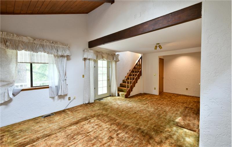 There is extra storage to the left & right at entrance of room. A French door at the base of the stairs leads to private balcony