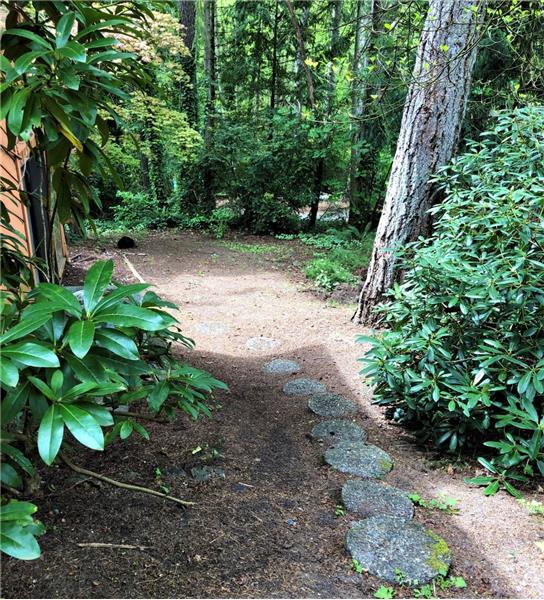 Wait before you leave, you truly must walk around the property and check out the back yard.  The feel is foresty! 