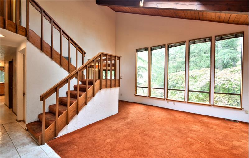 Large windows and a beautiful staircase welcome you from the front door.