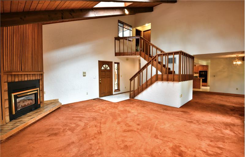 Another view of this gorgeous staircase!  It is so open and striking!  Beautiful rich wood!