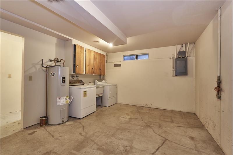 Large Utility Room. Lots of Storage Potential in this Room.