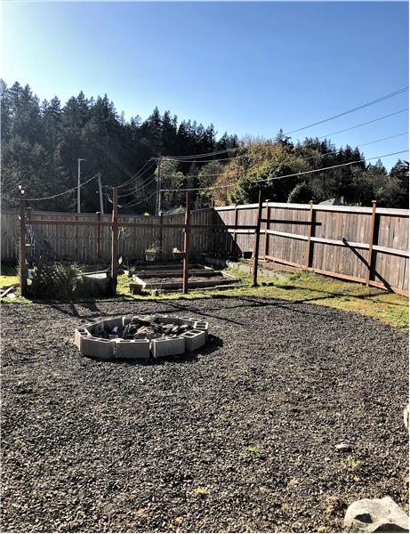 You won't want to miss this firepit!  In the distance is the separate garden area!