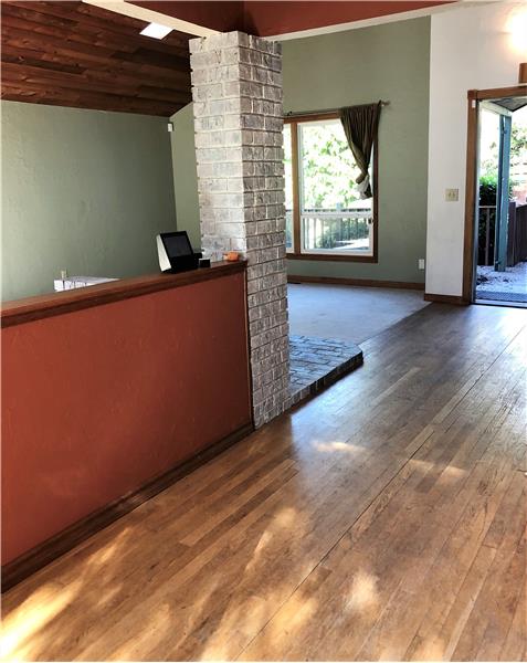 Beautiful hardwood floors, wood planked vaulted ceilings greet you! New carpet has been ordered and paid for by the Sellers