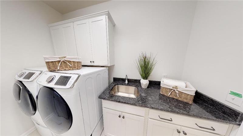 Laundry with New Pedestal Washer & Dryer with SS sink