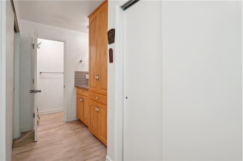 Walk-through closet area to primary bathroom