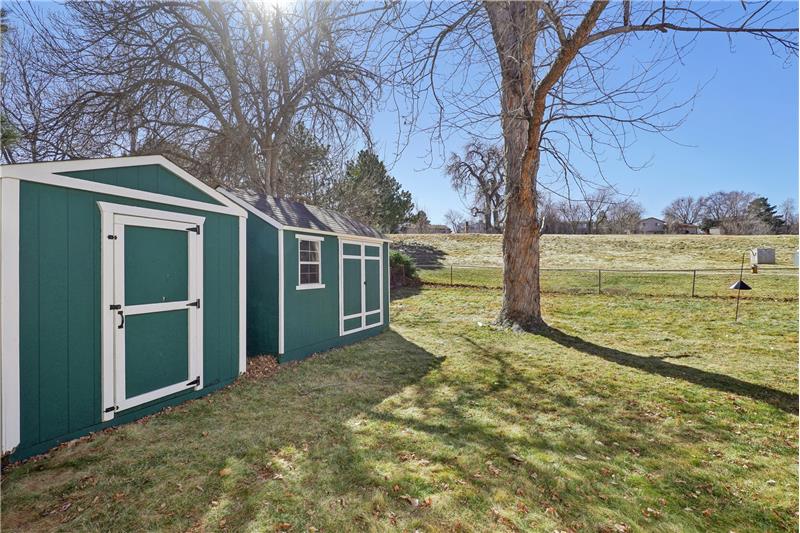 2 storage sheds in side yard