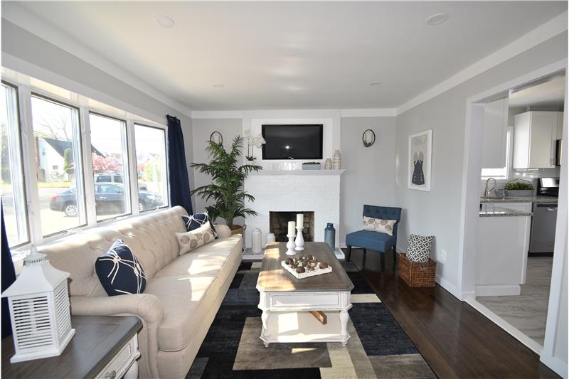 Living Room-Wood Burning Fireplace-H/W Floors