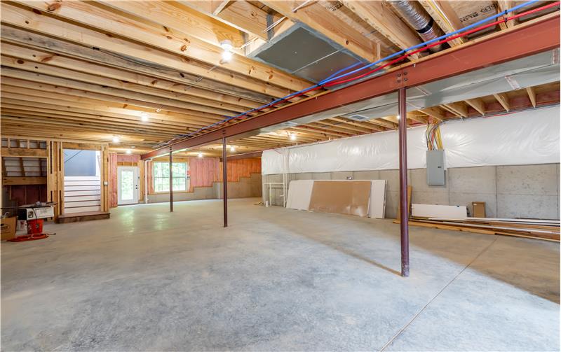 Basement with door leading to side patio