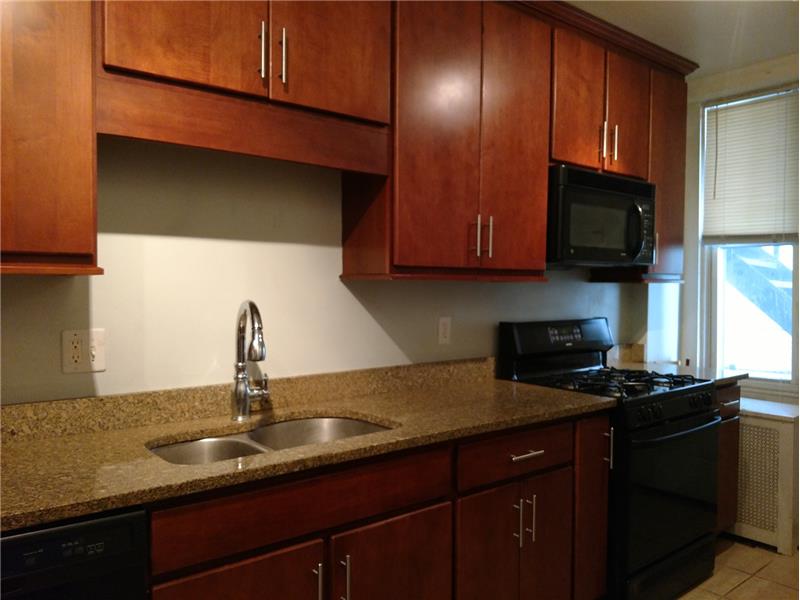 Kitchen has Tall Cabinets