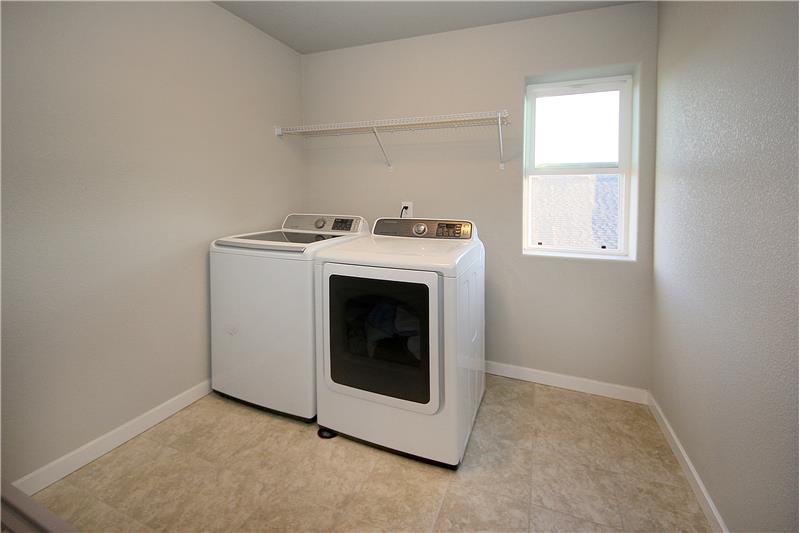 Upper level laundry with window is very roomy!