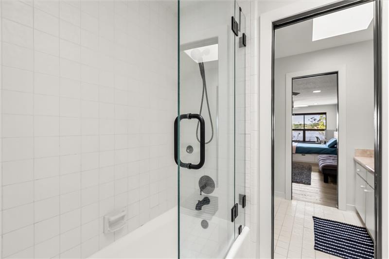 Bedroom 2 attached bath with frameless shower