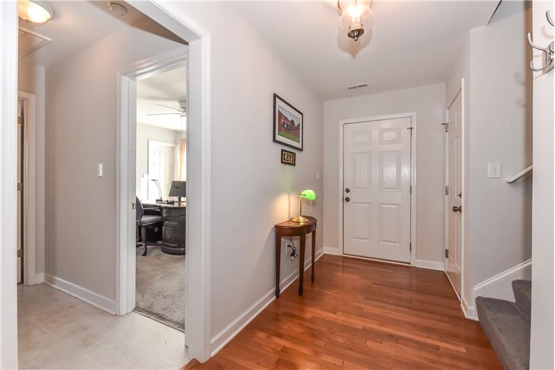 Foyer features hardwood floors, provides access to garage and to laundry room.
