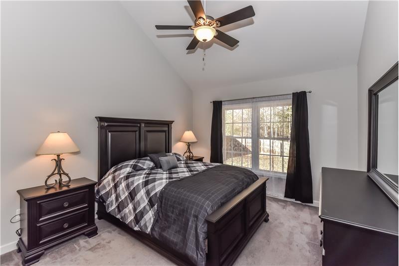 Serene and spacious master suite with room for king-size bed and large dresser.
