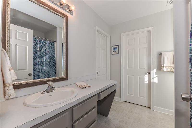 Master bath: xxtended vanity with storage, updated mirror, two walk-in closets.