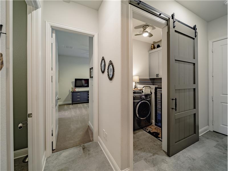 Large laundry room with wet area and barn door