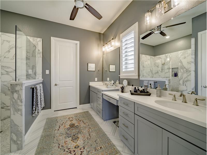 Beautiful and functional Master Suite Bath with a ceiling fan