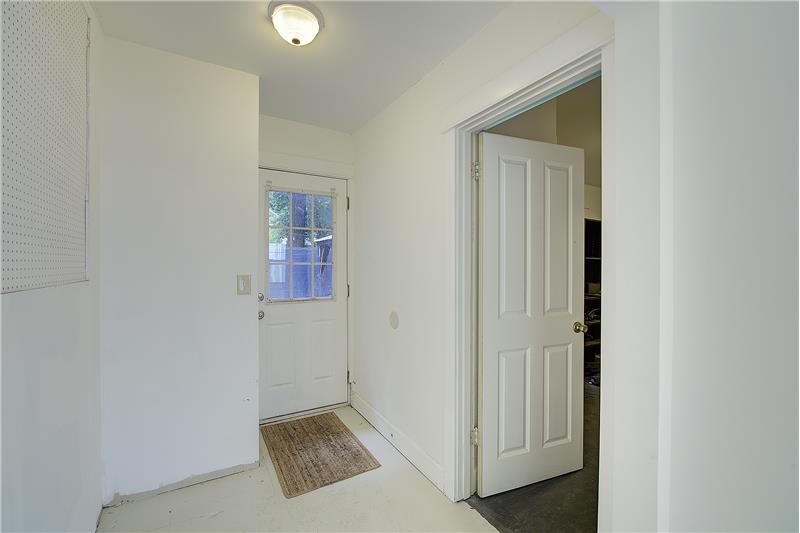 Hallway to the back yard, and entry to 4th bedroom