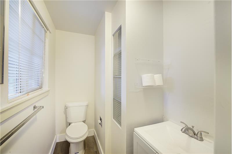 Toilet & sink, off of Primary Bedroom