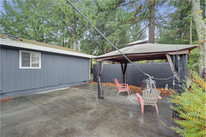 Primary bedroom, overlooking/fenced patio