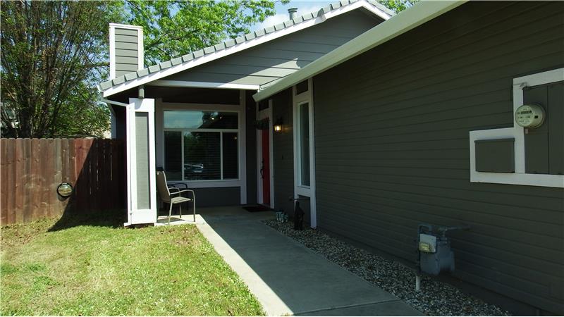 The Covered Entry Way Draws You Into the Home.