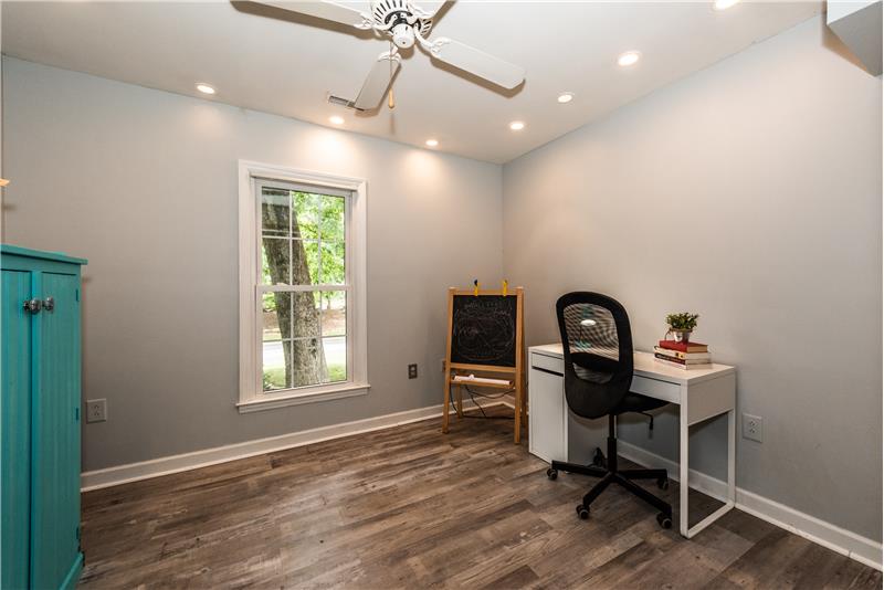 Office situated at the front of the home and features recessed lighting, luxury vinyl plank flooring.