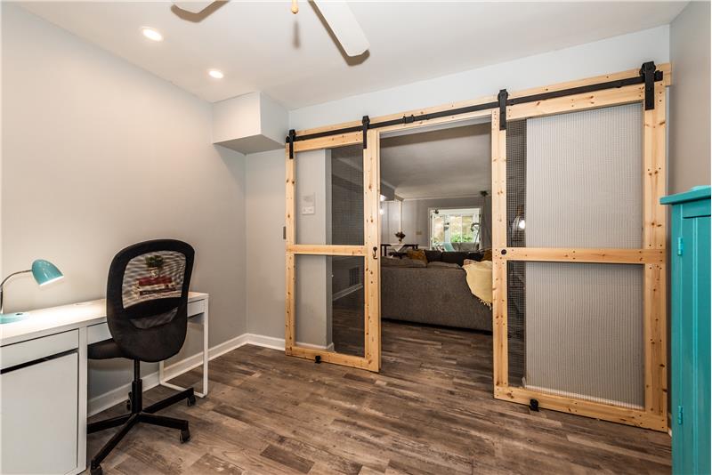 Don't need a home office? Use the room as a play room or a crafts room. Custom barn doors.