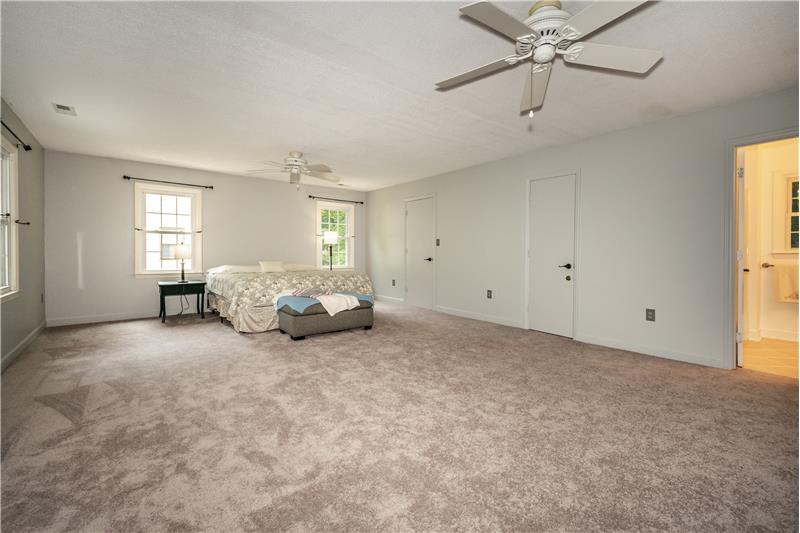 Second floor owner's suite features brand new carpet, walk-in-closet, en-suite bathroom.