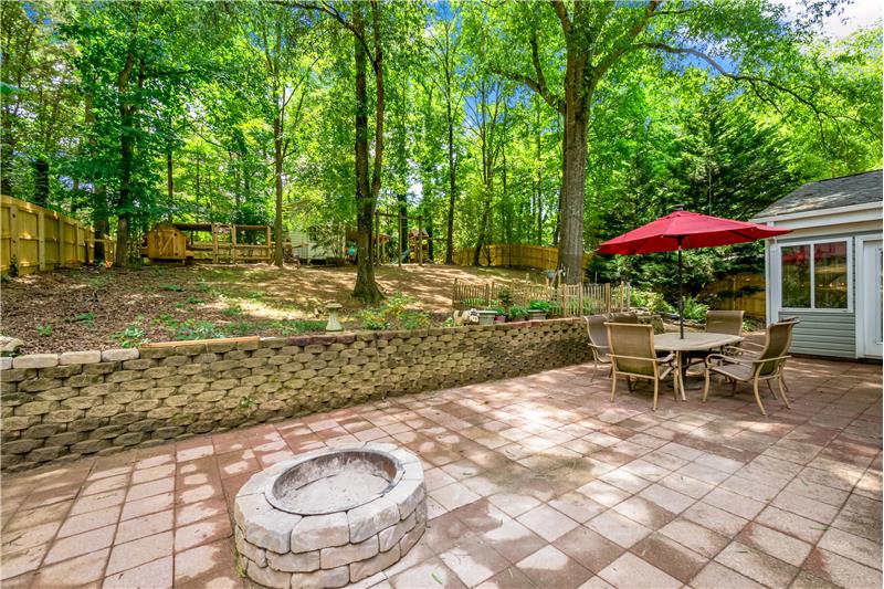 Large paver patio with fire pit. 