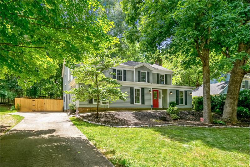 Welcome home to this serene and peaceful setting with mature trees everywhere you look.