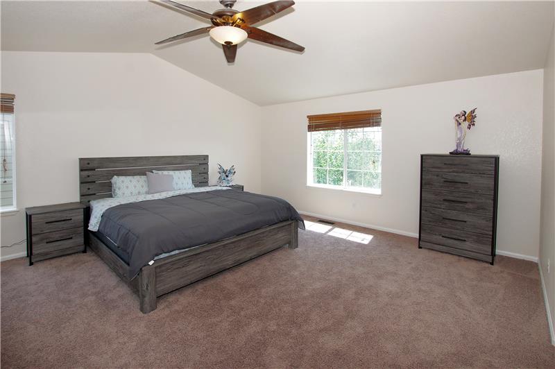Huge master bedroom with vaulted ceilings and ceiling fan