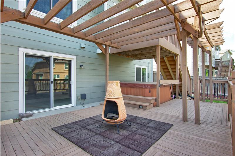 Lower deck with pergola. Salt water hot tub and chiminea included!