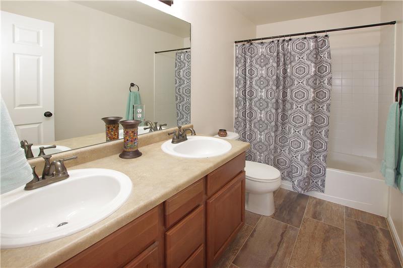 Full bath on upper level with double sinks