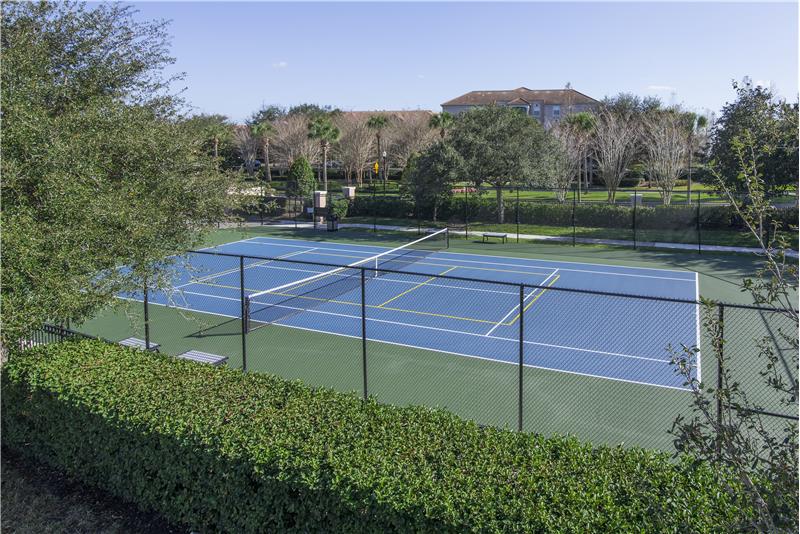 community tennis court behind unit