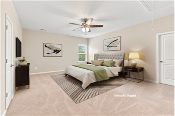Flexible floor plan: virtually staged, one of two spacious bedrooms on home's upper floor.