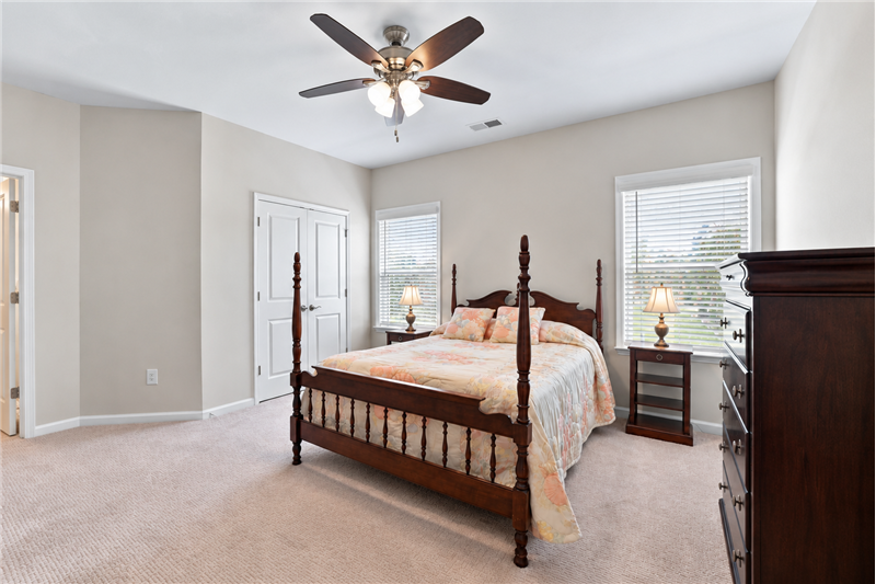One of two spacious bedrooms on home's upper floor.
