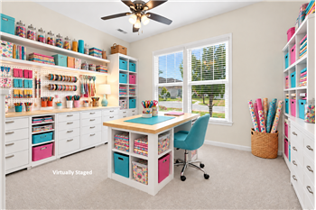 Flexible floorplan: one of two bedrooms at the front of the home virtually staged as a crafts room.