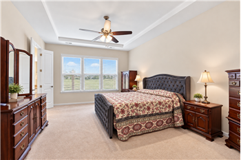 Spacious, main-level primary suite: comfortable place to retreat, relax, recharge at the end of the day. Room for sitting area.