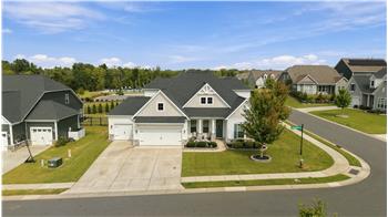 3-car garage with epoxy flooring, expansive driveway provide excellent parking and storage space. Welcome home!