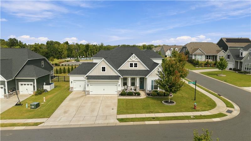 3-car garage with epoxy flooring, expansive driveway provide excellent parking and storage space. Welcome home!