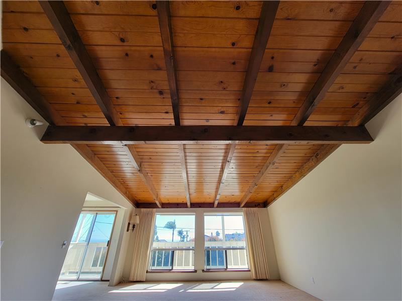 Yes! An original vaulted tongue and groove ceiling that has NOT been painted over through the years! So nice to see!!
