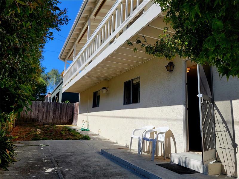 Private patio and grassy area off the Permitted Space downstairs!