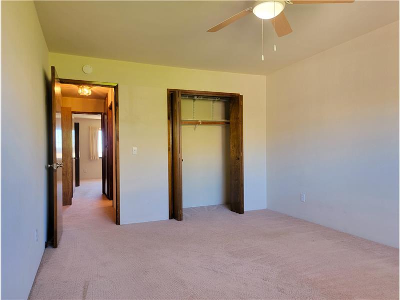 East facing Bedroom 3 enjoys morning sun and ceiling fan!