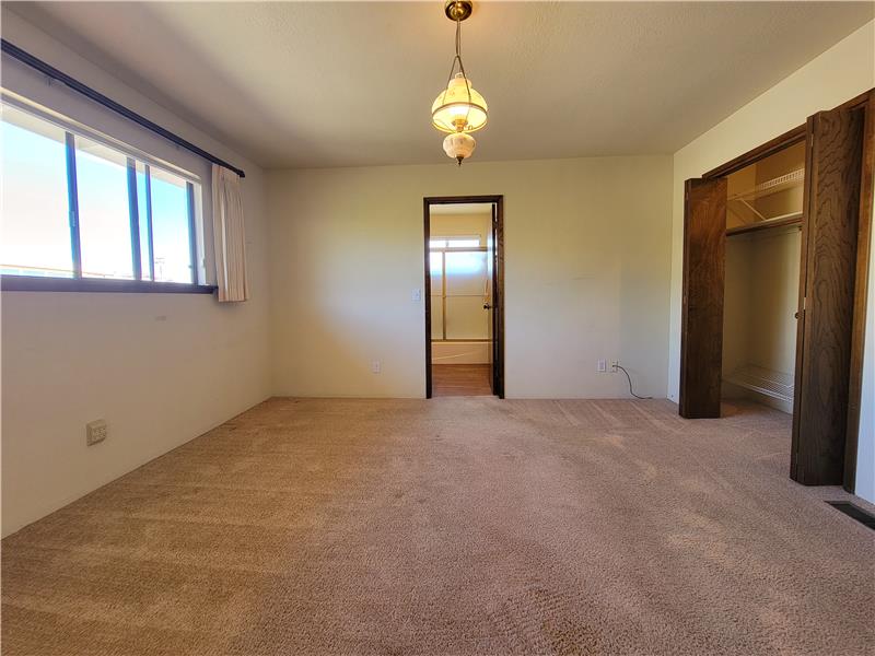 Primary Bedroom enjoys dual wall length closets and an amazing view!