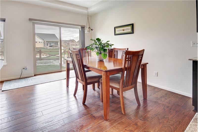 Eat-in Dining Area off the Kitchen with walkout to the expanded backyard patio with Peak views