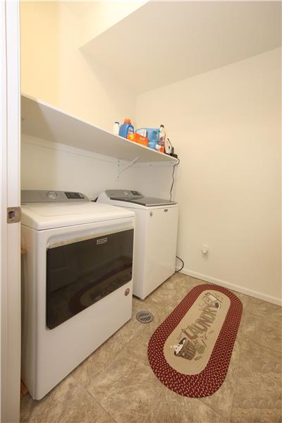 The main level Laundry Room is off the Entry