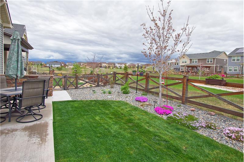The low-maintenance fenced lot backs to walking trails/open space